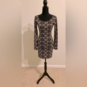 Black/ tan. Long sleeve dress. New with tags. Size S